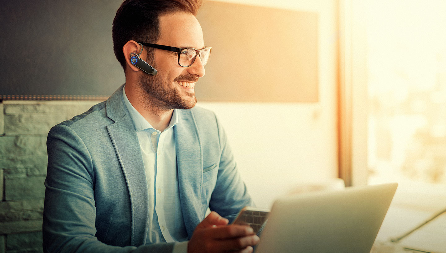 Subject enjoying HK500+ wireless mono headset with Multipoint connectivity